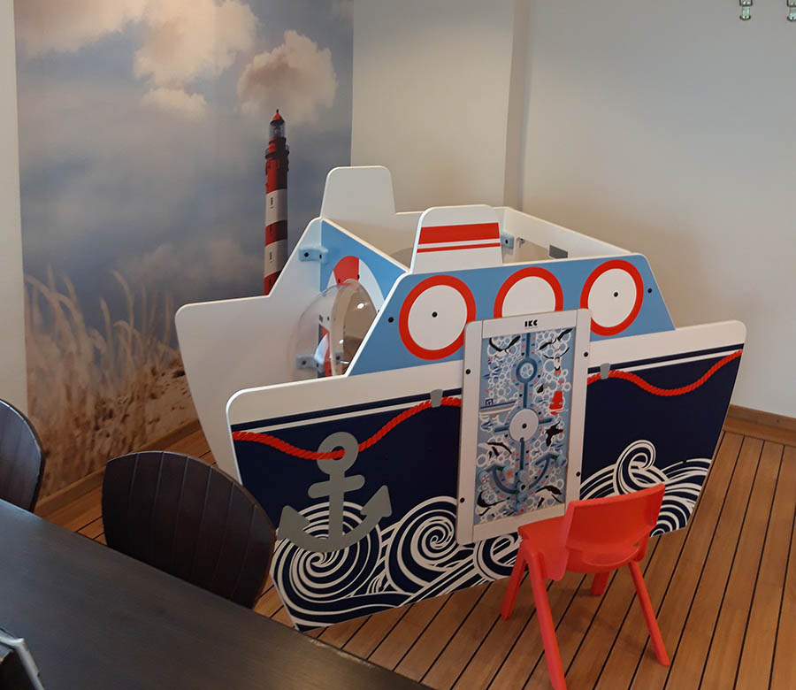 On this image you can see a kids' corner for a dentist practice