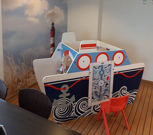 On this image you can see a kids' corner for a dentist practice